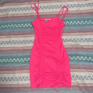 Neon pink sleeveless ruched mini dress